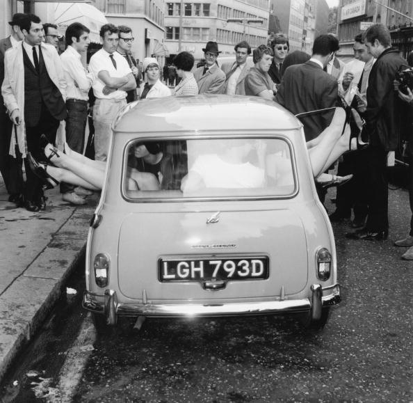 Fifteen young women crammed into an Austin Mini, bringing to Britain the new world record for the number of people in a Mini. This effort beats the previous record set by US college students.   (Photo by Ron Case/Getty Images)